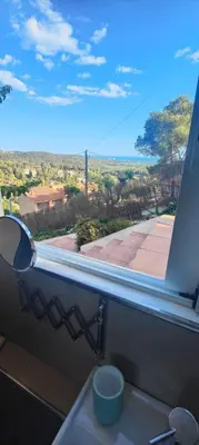 a window in a kitchen with a view of a street at Ànima del Garraf in Sitges