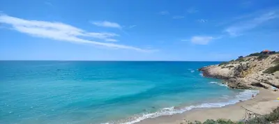 an aerial view of a beach and the ocean at Ànima del Garraf in Sitges