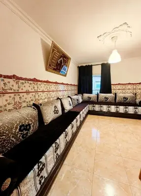 a living room with a long couch in a room at Mi casa es tu casa in Hospitalet de Llobregat