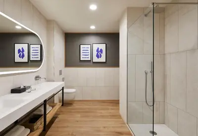 a bathroom with a shower and a toilet at Four Points by Sheraton Barcelona Airport in Barcelona