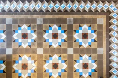 a tiled floor in a building with geometric patterns at BP2 - Big apartment for groups in BCN city center HUTB - 77390 in Barcelona