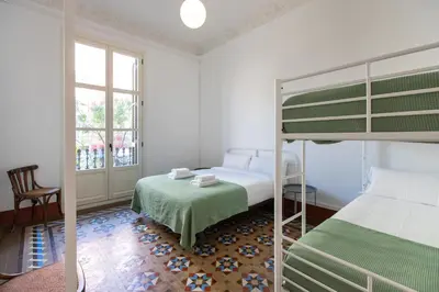 a bedroom with two beds and a bunk bed at BP2 - Big apartment for groups in BCN city center HUTB - 77390 in Barcelona