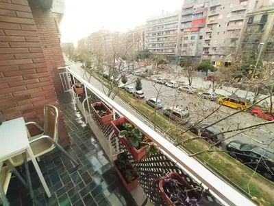 a view of a city street from a balcony at Spacious apartment in the heart of the city in Barcelona