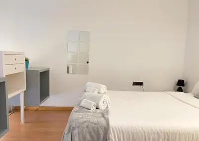a kitchen and dining room with a table and chairs at Duplex in Gracia in Barcelona
