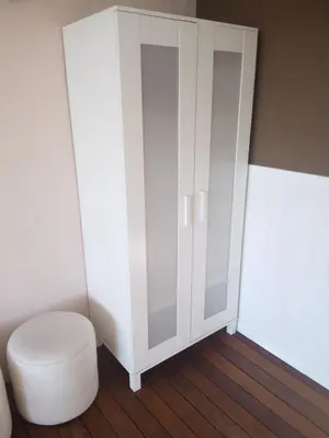 a white cabinet next to a toilet in a room at Apartamento con piscina y barbacoa cerca de Barcelona in Teià