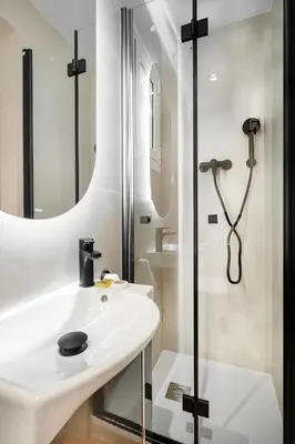 a bathroom with a sink and a shower at Happy Apartments in Barcelona