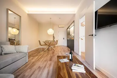 a living room with a couch and a table at Happy Apartments in Barcelona