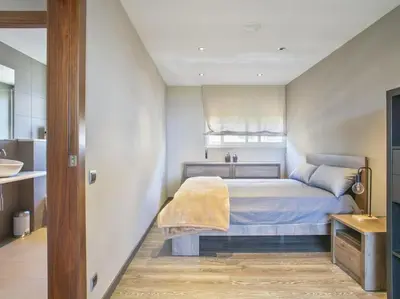 a white kitchen with a stove and a sink at Apartamento temporal en Barcelona in Barcelona