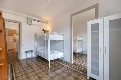 a bedroom with two bunk beds and a doorway at B41 - Apartamento para grandes grupos en BCN centro in Barcelona