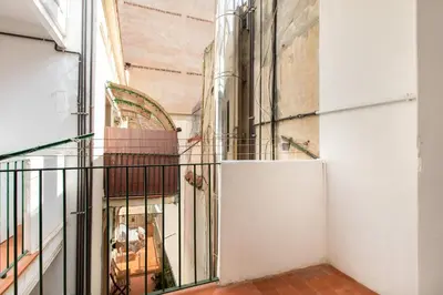 a view from the hallway of a building with a balcony at B41 - Apartamento para grandes grupos en BCN centro in Barcelona