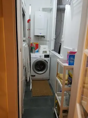 a laundry room with a washing machine in it at Apart 2 bedrooms 2 bathroom 30 nigth min WiFi washmachime elevator AC heather in Barcelona