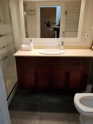 a bathroom with a sink and a mirror at Apart 2 bedrooms 2 bathroom 30 nigth min WiFi washmachime elevator AC heather in Barcelona