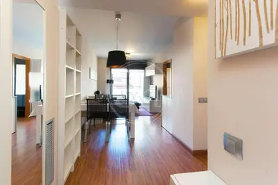 a living room with a table and a dining room at Apartment near the beach Pujades in Barcelona