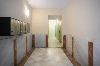 a room with a corridor with chairs in it at Palau de la música 3 in Barcelona