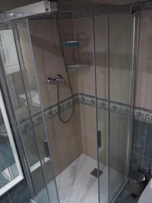 a shower with a glass door in a bathroom at Stylish Duplex Loft with terrace in Barcelona