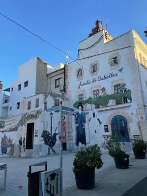 a building with a sign on the side of it at Have Fun Apartment in Cubelles in Cubelles