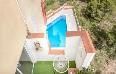 an overhead view of a house with a swimming pool at Amazing Apartment In Sant Pere De Ribes in Sant Pere de Ribes