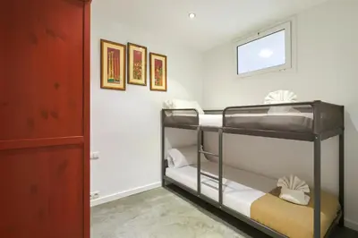 a bunk bed room with two bunk beds in it at 64 Apartment in a typical Barcelona's old building in Barcelona