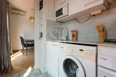 a bedroom with a large bed and a window at Cosy apartment with terrace in Barcelona