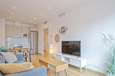 a living room with a couch and a table at Aspasios Arc de Triomf Apartments in Barcelona