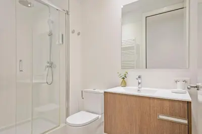 a bathroom with a shower and a toilet and a sink at Aspasios Arc de Triomf Apartments in Barcelona