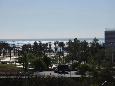 a truck parked in a parking lot next to the ocean at Piso en zona fòrum con vistas al mar in Barcelona