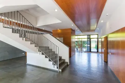 a hallway with a staircase in a house at Piso en zona fòrum con vistas al mar in Barcelona