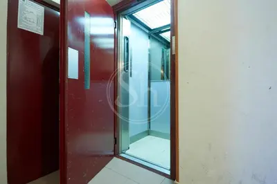 a glass door in an elevator in a building at Nice apartment in Les Corts in Barcelona