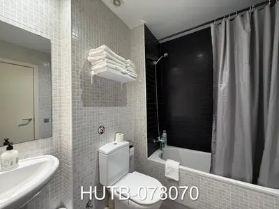 a bathroom with a toilet and a sink and a shower at Palau de la música 10 in Barcelona