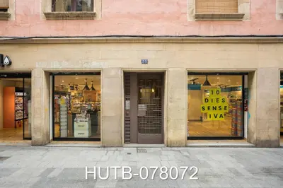 a store front with windows with signs in it at Palau de la música 12 in Barcelona