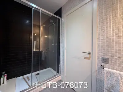 a shower with a glass door in a bathroom at Palau de la música 13 in Barcelona