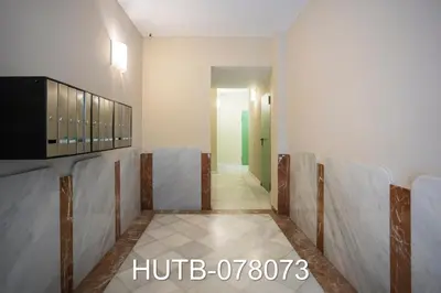 a room with a corridor with chairs and a hallway at Palau de la música 13 in Barcelona