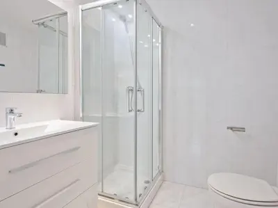 a bathroom with a shower and a toilet and a sink at Alcam Espronceda in Barcelona