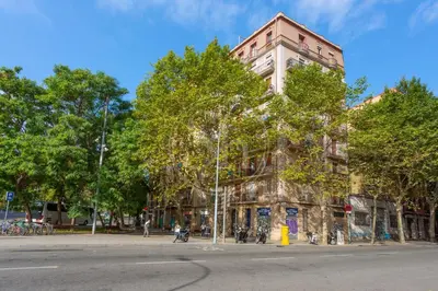 a building on the corner of a street at Cozy apartment near Sagrada Familia in Barcelona