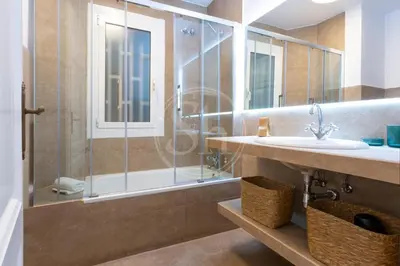 a living room with a couch and a table at Apartamento cerca de Sagrada Familia in Barcelona