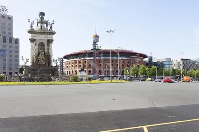 a large building with a clock tower in a city at Moderno apartamento familiar en Eixample in Barcelona
