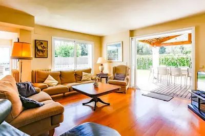 a living room with a couch and a table at Villa Romady in Sant Pere de Ribes