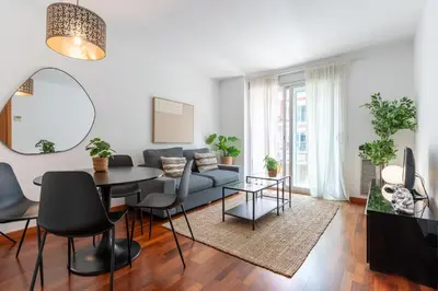 a living room with a couch and a table at Lovely apartment Sagrada Familia in Barcelona