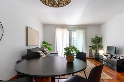 a living room with a table and a couch at Lovely apartment Sagrada Familia in Barcelona