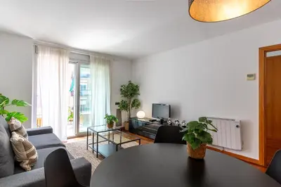 a living room with a table and a couch at Lovely apartment Sagrada Familia in Barcelona