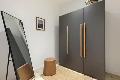 a bedroom with a large bed with a tray on it at Jaiz - 2 bedrooms and terrace in Eixample Esquerra in Barcelona