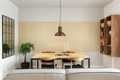 a dining room with a table and a couch at Jaiz - 2 bedrooms and terrace in Eixample Esquerra in Barcelona