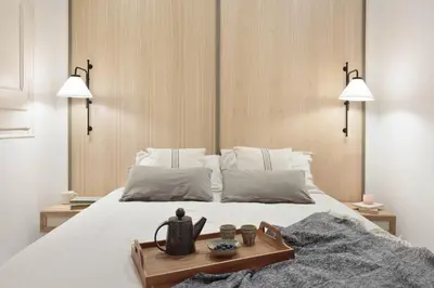 a living room with a couch and a tv at Jaiz - 2 bedrooms and terrace in Eixample Esquerra in Barcelona