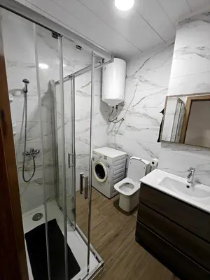 a bathroom with a shower and a toilet and a sink at Gorgeous Appartment in Martorell-Barcelona in Martorell