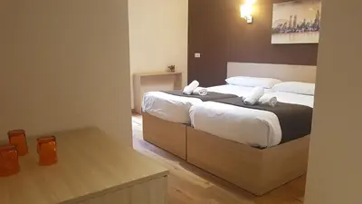 a bedroom with two beds with white sheets at Hostal Barcelona Travel in Barcelona