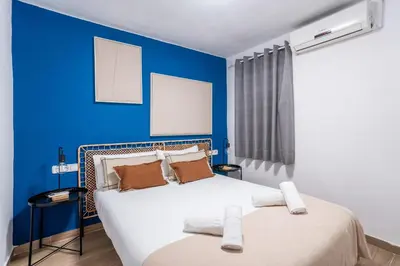 a living room with a washing machine and a couch at The Collection Barcelona - Eixample 4BD 2BTh with private Terrace in Barcelona