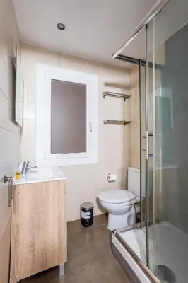 two beds in a room with blue walls at The Collection Barcelona - Eixample 4BD 2BTh with private Terrace in Barcelona