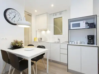 a white counter top with a bowl on a table at Wonderful apartment for 6 in Barcelona