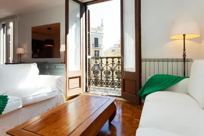 a living room with a couch and a coffee table at Céntrico apartamento familiar in Barcelona