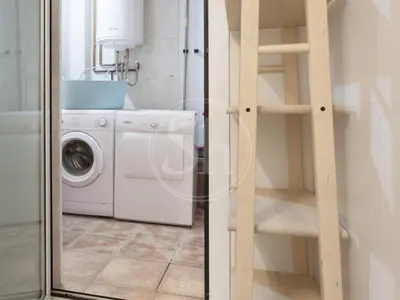a laundry room with a washer and a washing machine at Nice apartment on Valencia Street in Barcelona